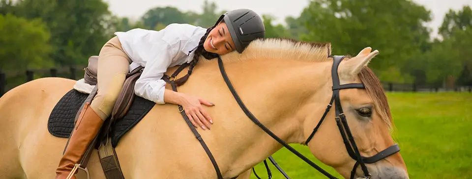 Woman enjoying riding on horseback